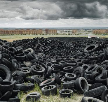 Pile of old tyres outside of city --- Image by © Gu/Corbis